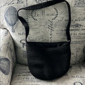 Black Woven Shoulder Bag with Textured Design the sak